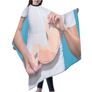 Personality  Cropped Shot Of Woman Holding Paper Crafted Stomach In Hands On Blue Background Hair Cutting Cape