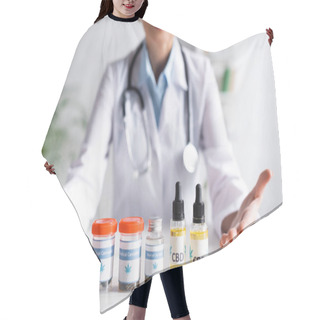 Personality  Cropped View Of Doctor Pointing With Hands At Bottles With Cbd And Medical Cannabis Lettering  Hair Cutting Cape