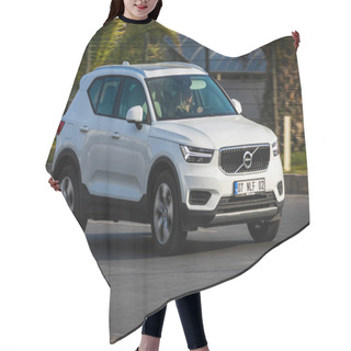 Personality  Alanya, Turkey   April 17  2021:    White Volvo XC40  Is Driving Fast On The Street On A Warm Summer Day Against The Backdrop Of A  Palms   Hair Cutting Cape