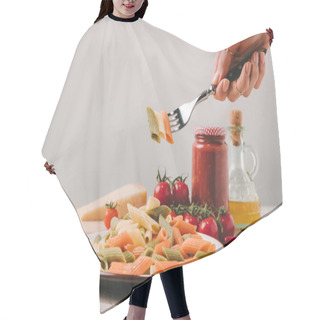 Personality  Cropped Shot Of Woman Eating Colored Pasta With Fork On Concrete Tabletop Hair Cutting Cape