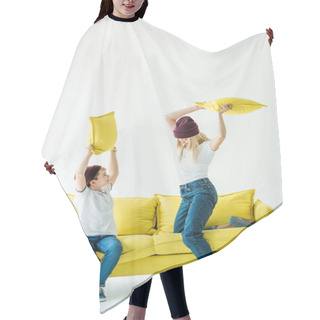 Personality  Mother And Son In Casual Clothes Having Fun And Fighting With Pillows On Yellow Sofa On White Hair Cutting Cape