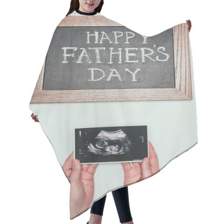 Personality  Cropped Shot Of Woman With Ultrasound Scan In Hands And Happy Fathers Day Blackboard Isolated On Grey Hair Cutting Cape