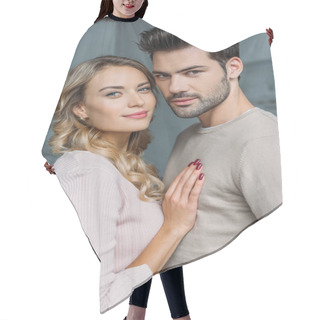 Personality  Portrait Of Young Affectionate Boyfriend And Girlfriend Looking At Camera At Home Hair Cutting Cape