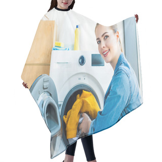 Personality  Young Woman Smiling At Camera While Putting Laundry Into Washing Machine Hair Cutting Cape