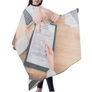 Personality  Cropped View Of Businessman Pointing With Finger At Compensation Claim Form While Woman Holding Pencil And Clipboard Hair Cutting Cape