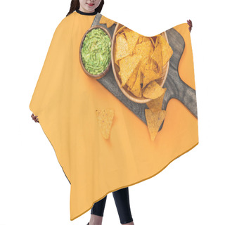 Personality  Top View Of Crispy Mexican Nachos Served With Guacamole On Wooden Cutting Board On Orange Background Hair Cutting Cape