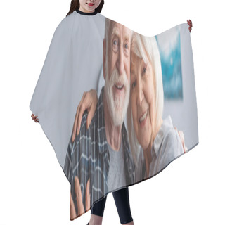 Personality  Horizontal Image Of Happy Senior Couple Smiling And Embracing While Looking At Camera Hair Cutting Cape