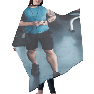 Personality  Cropped View Of Young Sportsman Using Smartphone In Gym Hair Cutting Cape