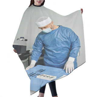 Personality  A Man In A Surgical Gown Performs Precision Operation On A Machine. Hair Cutting Cape