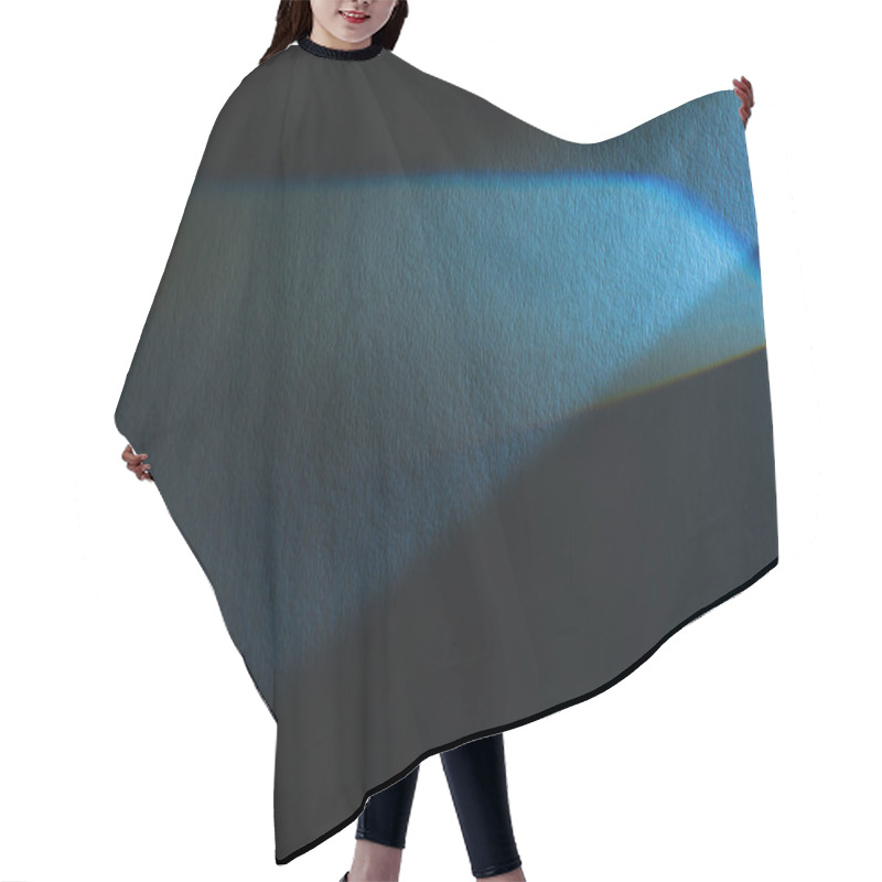 Personality  light prism with beam on blue and black texture background hair cutting cape