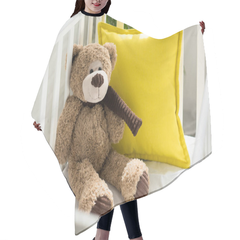 Personality  close up view of teddy bear and yellow pillow in baby crib at home hair cutting cape