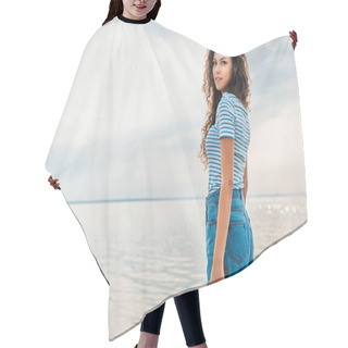 Personality  Attractive Curly Girl In Casual Clothes Posing Near The Seas  Hair Cutting Cape