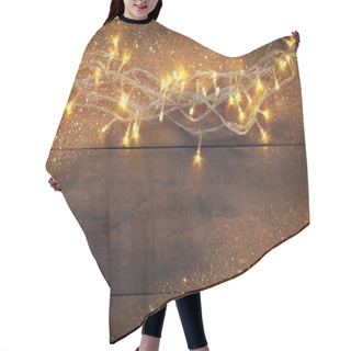 Personality  Christmas Warm Gold Garland Lights On Wooden Rustic Background. Filtered Image With Glitter Overlay. Hair Cutting Cape