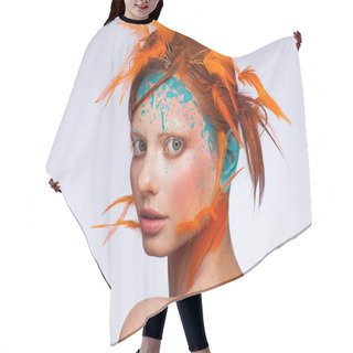 Personality  Portrait Of A Beautiful Model With Creative Make-up And Hairstyle Using Orange Feathers Hair Cutting Cape