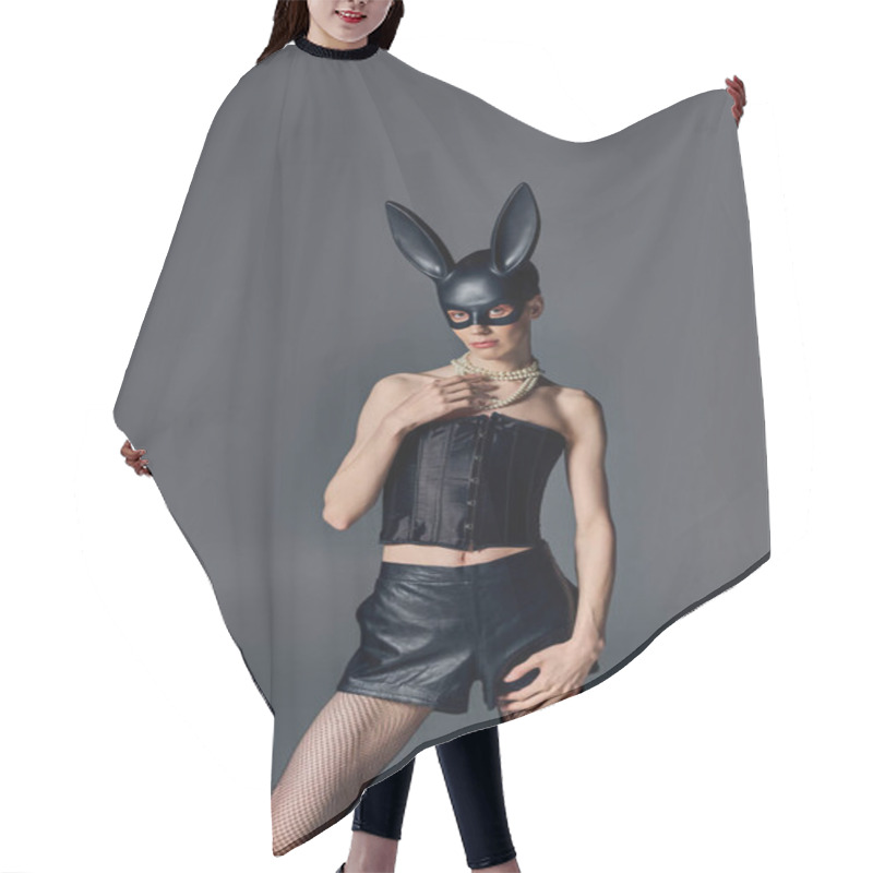 Personality  Androgynous Model In Corset Posing In Bdsm Bunny Mask On Grey, Queer Fashion, Provocative Style Hair Cutting Cape