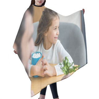 Personality  Cropped Image Of Daughter Sitting With Cup Of Cacao With Marshmallow And Looking Away Hair Cutting Cape