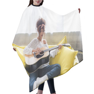 Personality  Curly Woman Playing Acoustic Guitar On Sofa In Living Room  Hair Cutting Cape