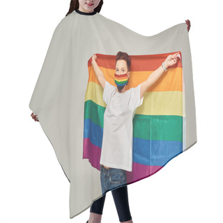 Personality  Redhead Queer Model In White T-shirt And Rainbow Colors Medical Mask Holding LGBT Flag On Grey Hair Cutting Cape