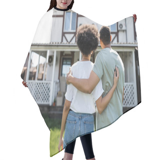 Personality  Back View Of African American Couple Hugging While Standing Near New House On Background Hair Cutting Cape