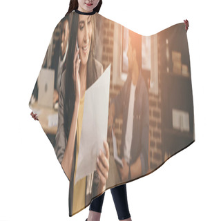 Personality  Cropped View Of Casual Businesswoman Working And Talking On Smartphone In Loft Office With Colleagues And Backlit Behind Hair Cutting Cape