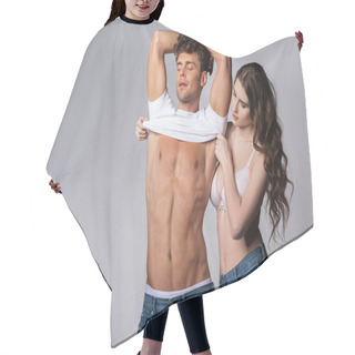 Personality  Attractive Girl In Bra Taking Off White T-shirt Of Muscular Boyfriend Isolated On Grey  Hair Cutting Cape