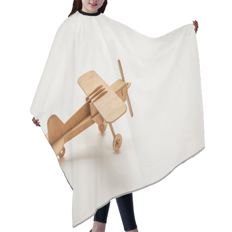 Personality  toy plane on grey background with copy space hair cutting cape