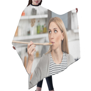 Personality  Woman Holding Wooden Spoon And Trying Food While Cooking In Kitchen  Hair Cutting Cape