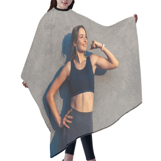 Personality  Portrait Of Happy Strong Fitness Woman In Sportswear Smiling Showing Her Biceps On Gray Wall Background, Doing Sports Outdoors Hair Cutting Cape