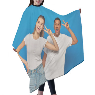 Personality  Cheerful Multicultural Couple Showing V Sign And Looking At Camera On Blue Background, Positivity Hair Cutting Cape