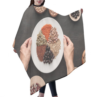 Personality  Cropped View Of Man Holding White Plate With Various Raw Legumes And Cereals Near Bowls On Dark Wooden Surface Hair Cutting Cape