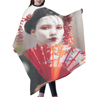Personality  Selective Focus Of Tree Branches And Beautiful Geisha With Red And White Makeup Holding Hand Fan In Sunlight Hair Cutting Cape
