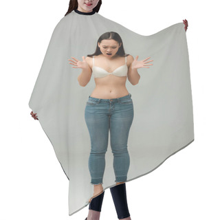 Personality  Shocked Asian Overweight Girl In Jeans And Bra Standing On Scales And Gesturing On Grey Hair Cutting Cape