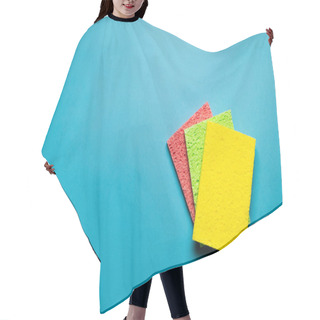 Personality  Top View Of Bright Yellow, Green And Pink Sponge Cloths On Blue Background Hair Cutting Cape