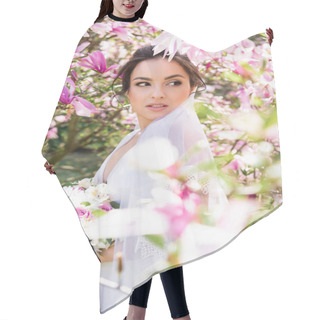 Personality  Bride With Bouquet Looking Away Near Blooming Magnolia Tree  Hair Cutting Cape