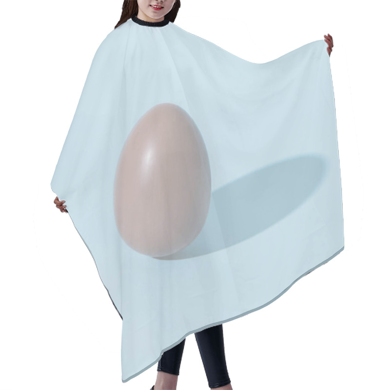 Personality  Chocolate Egg On Blue Pale Background With Shadow Hair Cutting Cape