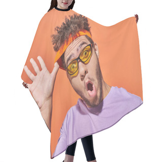 Personality  Funny African American Man In Sunglasses Adjusting Headband On Orange Background, Surprised Face Hair Cutting Cape