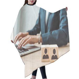 Personality  Cropped View Of Businesswoman Typing On Laptop Near Wooden Cubes With Human Shapes  Hair Cutting Cape