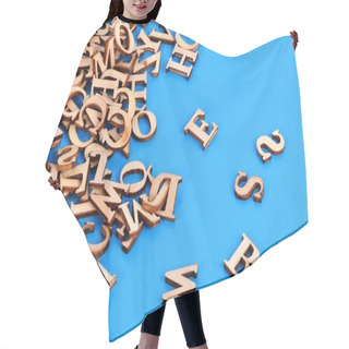 Personality  A Heap Of Wooden Letters Are Lying In The Blue Studio Hair Cutting Cape