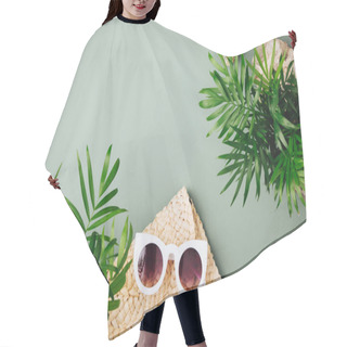 Personality  Tropical Leaves And Beach Bag With Sunglasses  On  Green  Background. Top View, Flat Lay. Hair Cutting Cape