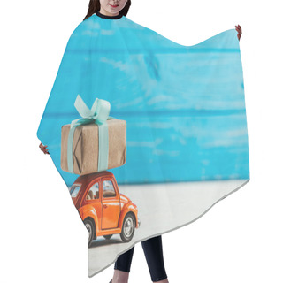 Personality  Close-up Shot Of Toy Vehicle With Gift Box On Blue Wooden Background Hair Cutting Cape
