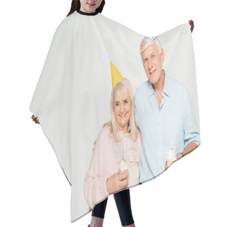 Personality  Happy Senior Husband And Wife Holding Birthday Cupcakes And Smiling At Camera Isolated On Grey Hair Cutting Cape