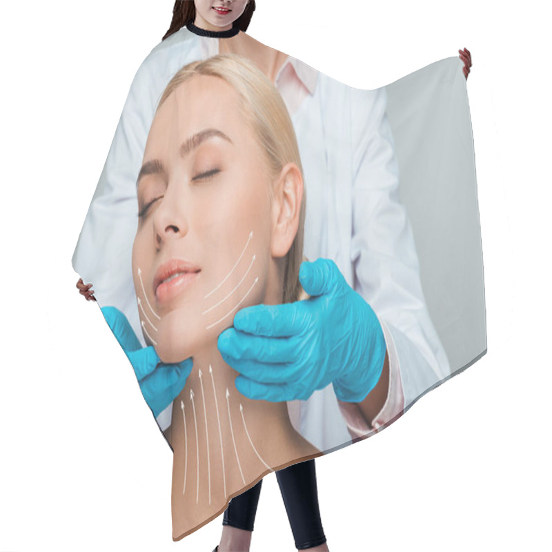 Personality  Cropped View Of Beautician In Blue Latex Gloves Touching Neck Of Naked Woman With Closed Eyes And Facelift Marks On Face Isolated On Grey  Hair Cutting Cape