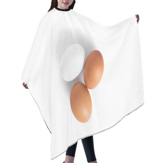 Personality  Eggs Are Isolated On A White Background. Brown And White Eggs. Hair Cutting Cape