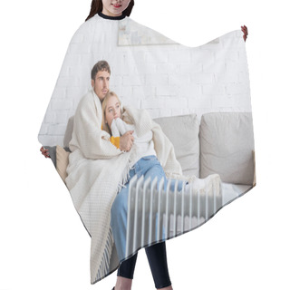Personality  Young Couple Covered In Warm Blanket Hugging On Couch Near Radiator Heater At Home  Hair Cutting Cape