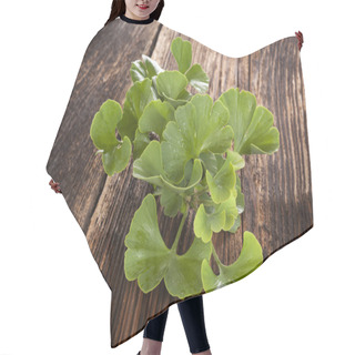 Personality  Ginkgo Biloba On Wooden Background. Hair Cutting Cape