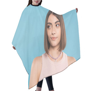Personality  Doubting, Young Brunette Woman With Short Hair And Nose Piercing Standing In Tank Top And Looking Away On Blue Background, Youth Culture, Skepticism, Generation Z, Summer Fashion  Hair Cutting Cape