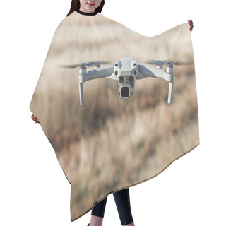 Personality  Close Up Photo Of Flying Drone With Digital Camera. Hair Cutting Cape