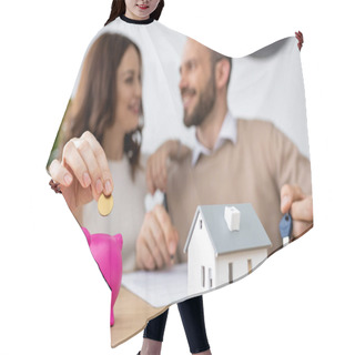 Personality  Selective Focus Of Happy Woman Putting Golden Coin In Pink Piggy Bank Near Cheerful Man  Hair Cutting Cape