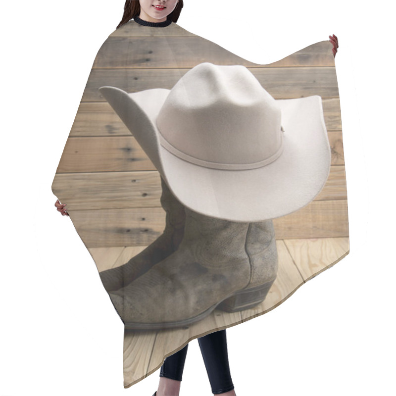Personality  Cowboy Boot And Western Hat On Wooden Background. Hair Cutting Cape