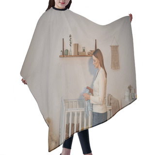 Personality  Side View Of Frustrated Woman Holding Baby Clothes Near Crib With Soft Toys In Nursery Room Hair Cutting Cape